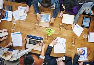 Team of consultants analysing data together at a desk