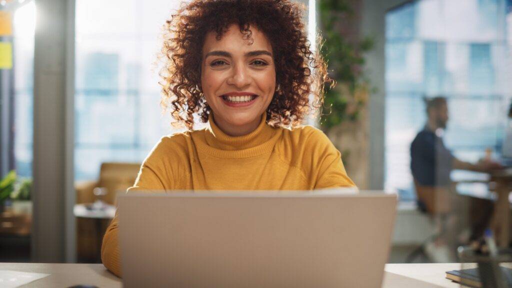 Smiling female professional in an office