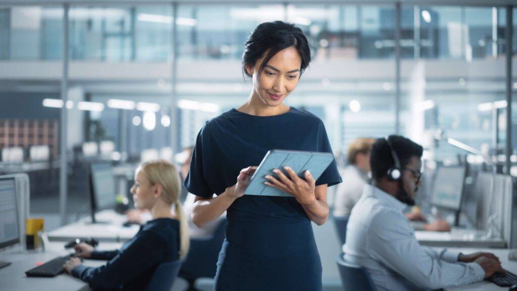 Female professional working on a tablet in an office